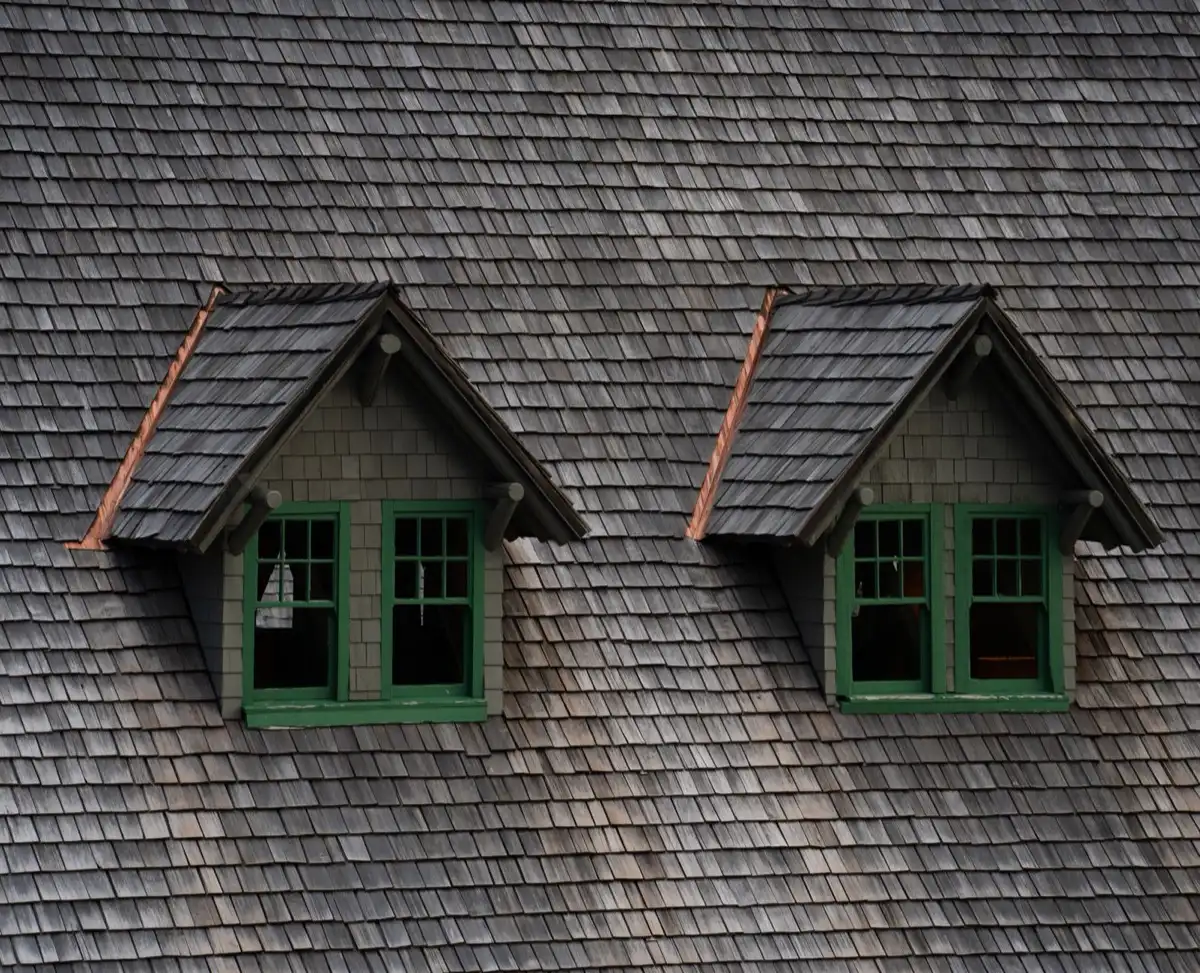 Dormers on a shingle roof in Fernley, NV, where step flashing and kickout flashing carry water past the walls